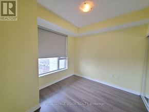 Toronto (Henry Farm) condo for rent - A room with a window and a wooden floor.