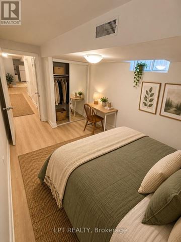 Mississauga (Churchill Meadows) apartment for rent - A bedroom with a bed, desk, and closet.
