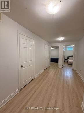 Mississauga (Churchill Meadows) apartment for rent - A hallway with wood floors and white walls.