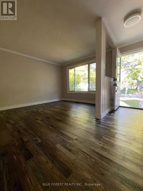 London South (South Y) apartment for rent - A room with wooden flooring and a sliding glass door leading to a backyard.