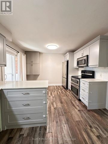 London South (South Y) apartment for rent - A kitchen with white cabinets and a wooden floor.