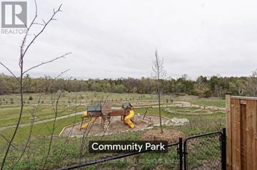 Oshawa (Samac) townhouse for rent - A community park with a playground and a picnic table.