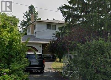 Toronto (Highland Creek) apartment for rent - A house with a car parked in front of it.