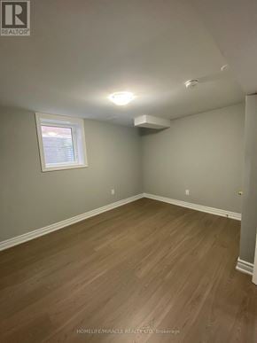Brampton (Brampton South) apartment for rent - A room with wooden flooring and a window.