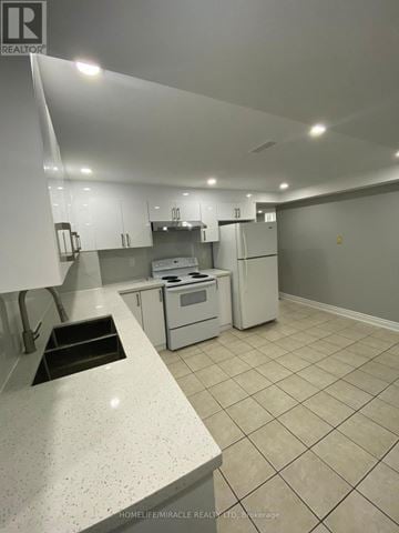 Brampton (Brampton South) apartment for rent - A kitchen with white cabinets and a white counter top.