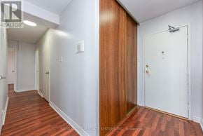 Burlington (Brant Hills) condo for rent - A hallway with a white door and a brown door.