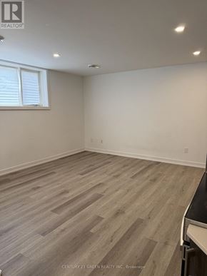 Niagara Falls (Downtown) condo for rent - A room with wooden flooring and a window.