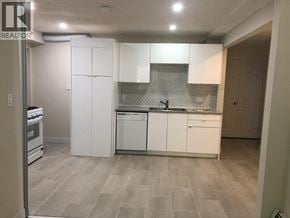 West Vancouver apartment for rent - A living room with a couch, dining table, and chairs.
