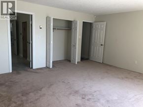 West Vancouver apartment for rent - A small kitchen with a refrigerator and a toaster.