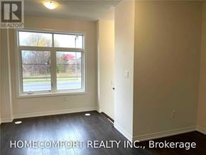 Markham (Cedar Grove) townhouse for rent - A room with a window and a sign that says "HOMECOMFORT REALTY INC., Brokerage".