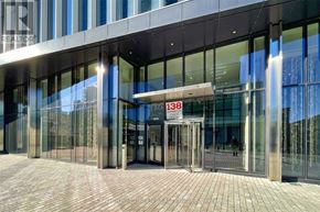 Toronto (Waterfront Communities) condo for rent - The entrance to a building with glass doors and a sign that reads "IM 138".