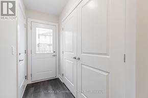 Hamilton (Stoney Creek Mountain) townhouse for rent - A hallway with white doors and a window.