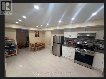 Toronto (Highland Creek) apartment for rent - A kitchen with white cabinets and stainless steel appliances is on the market with Century 21 Titans Realty.