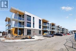 Ottawa condo for rent - A building under construction with a sign that says "THE AGENCY OTTAWA Brokerage".