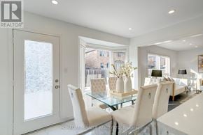 Brampton (Credit Valley) multi-family for rent - A white dining room with a glass table and chairs.