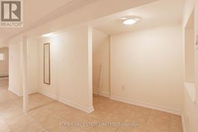 Toronto (Palmerston-Little Italy) apartment for rent - A room with white walls and a tiled floor.