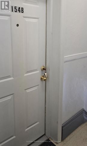Milton (Om Old Milton) apartment for rent - A white door with a brass handle and a number 154B above it.