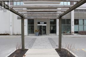 Markham (Wismer) condo for rent - The entrance to a building with the number 9560 on it.