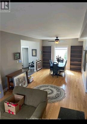Clarington (Bowmanville) apartment for rent - A living room with a grey couch and a rug.