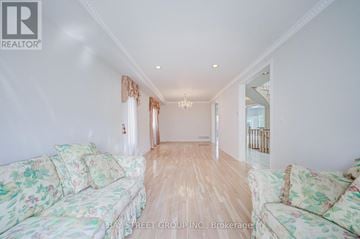 Markham (Cachet) apartment for rent - A living room with floral patterned sofas and a chandelier.