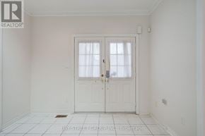 Markham (Cachet) apartment for rent - A white door with a glass window is in the middle of a white room.