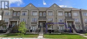 Mississauga (Churchill Meadows) townhouse for rent - A building with the sign "Dreamest Realty Inc., Brokerage" in front of it.