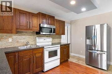 Windsor apartment for rent - A kitchen with wooden cabinets and stainless steel appliances.