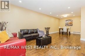 Brampton (Central Park) apartment for rent - A living room with a couch, chair, and table.