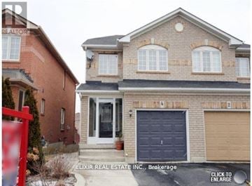 Brampton (Fletcher's Meadow) apartment for rent - A brick house with a red gate in front.