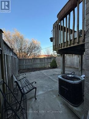 Brampton (Fletcher's Meadow) apartment for rent - A black cooler sits on a patio with a chair and railing.