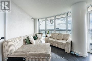 Toronto (Islington-City Centre West) condo for rent - A living room with two couches and a large window.