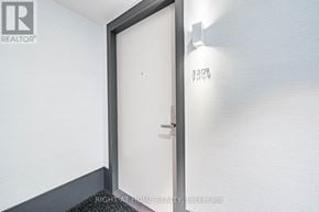Toronto (Islington-City Centre West) condo for rent - A door with a handle and a number 1309 on the wall above it.