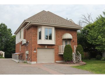 Gatineau (Hull) apartment for rent - A house with a brick facade and a garage door.