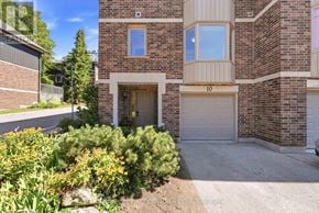 London North (North G) townhouse for rent - A brick house with a garage door numbered 10.
