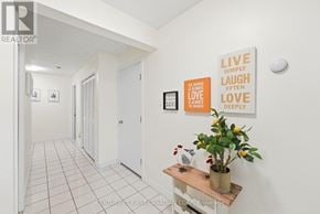 London North (North G) townhouse for rent - A hallway with a plant on a table and pictures on the wall.