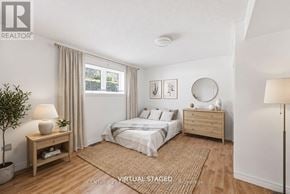 London North (North G) townhouse for rent - A bedroom with a bed, nightstand, and lamp.
