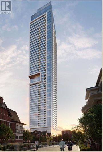 Toronto (North St. James Town) house for rent - A tall, modern glass building is depicted in an architectural rendering.