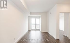 Barrie (Little Lake) condo for rent - A room with a window and a door in it.