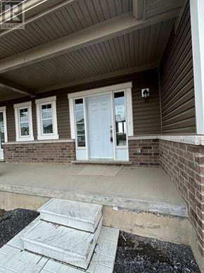 Loyalist (Bath) apartment for rent - A house with a white door and windows with a sign that says "For Sale".
