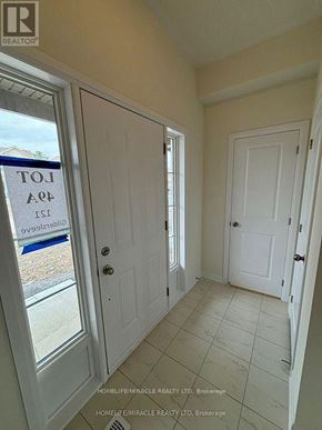 Loyalist (Bath) apartment for rent - A real estate sign is taped to a glass door.