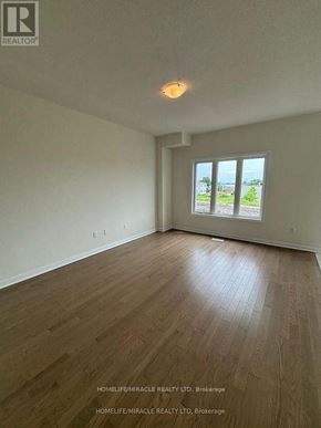 Loyalist (Bath) apartment for rent - A room with wooden flooring and a window showing a view of a street.