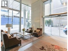 Vancouver apartment for rent - A living room with a glass door leading to a balcony.