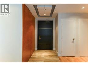 Vancouver apartment for rent - A hallway with a white door and a black door.