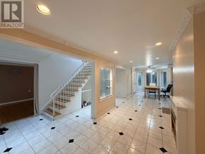 Toronto (Hillcrest Village) apartment for rent - A spacious living room with a staircase and a dining area.