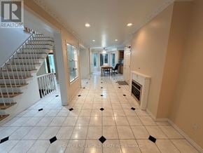 Toronto (Hillcrest Village) apartment for rent - A spacious living room with a staircase on the left side.