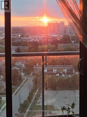 Toronto (Wexford-Maryvale) condo for rent - A sunset view from a window overlooking a cityscape.