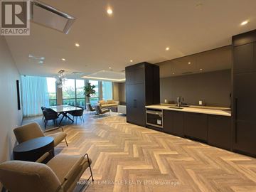 Milton (Tm Timberlea) condo for rent - A modern living room with a dining table and chairs.