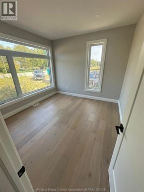 Lasalle apartment for rent - A room with a large window and wooden flooring.