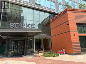 Toronto (North St. James Town) condo for rent - A modern building with a glass facade and a red brick structure with the word "BURKE" on it.