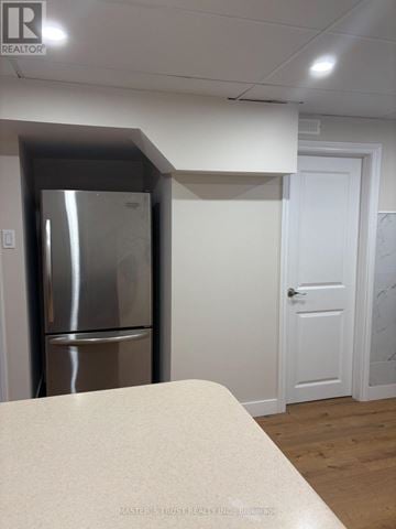 Toronto (Agincourt North) apartment for rent - A stainless steel refrigerator sits in a kitchen corner.